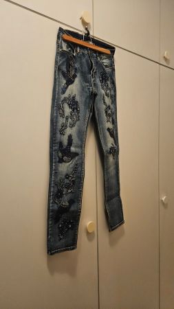 Jeans con uccelli ricamati tg.S