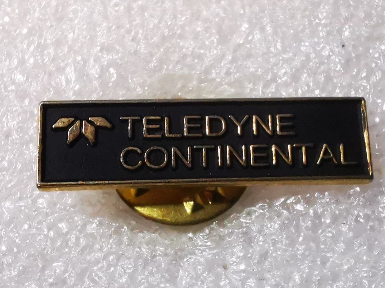 Placchette & Badge: Ansteckpin 14: Teledyne – Usato da Oppligen venduto da Pin-Fall-Shop