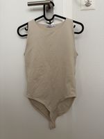 Body beige sans manches taille L état neuf