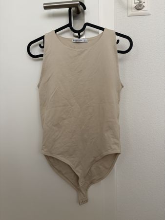 Body beige sans manches taille L état neuf