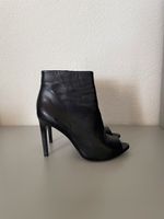 Bottes Buffalo en cuir noir à talons hauts, taille 38.