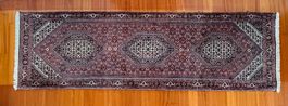 Orientteppich handgeknüpft Iran 247x77 cm rot schwarz