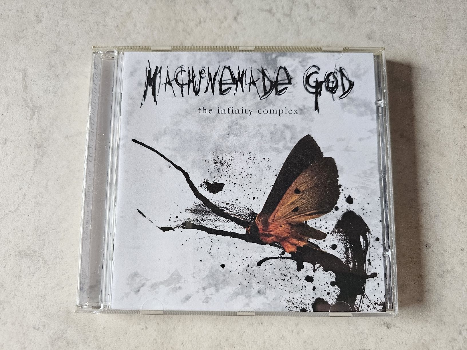CD: Machinemade God  -  The Infinity Complex – Usato da Schneisingen venduto da backstore24