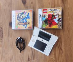ab1.- Nintendo DS + 2 jeux + chargeur