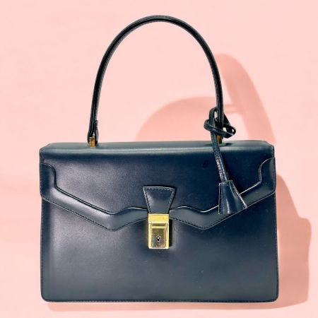 Petit sac à main vintage en cuir noir avec fermeture à clé