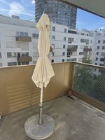 Large Sun umbrella with a heavy marble stand