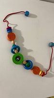 Kinderwagenkette Holz Glocke 