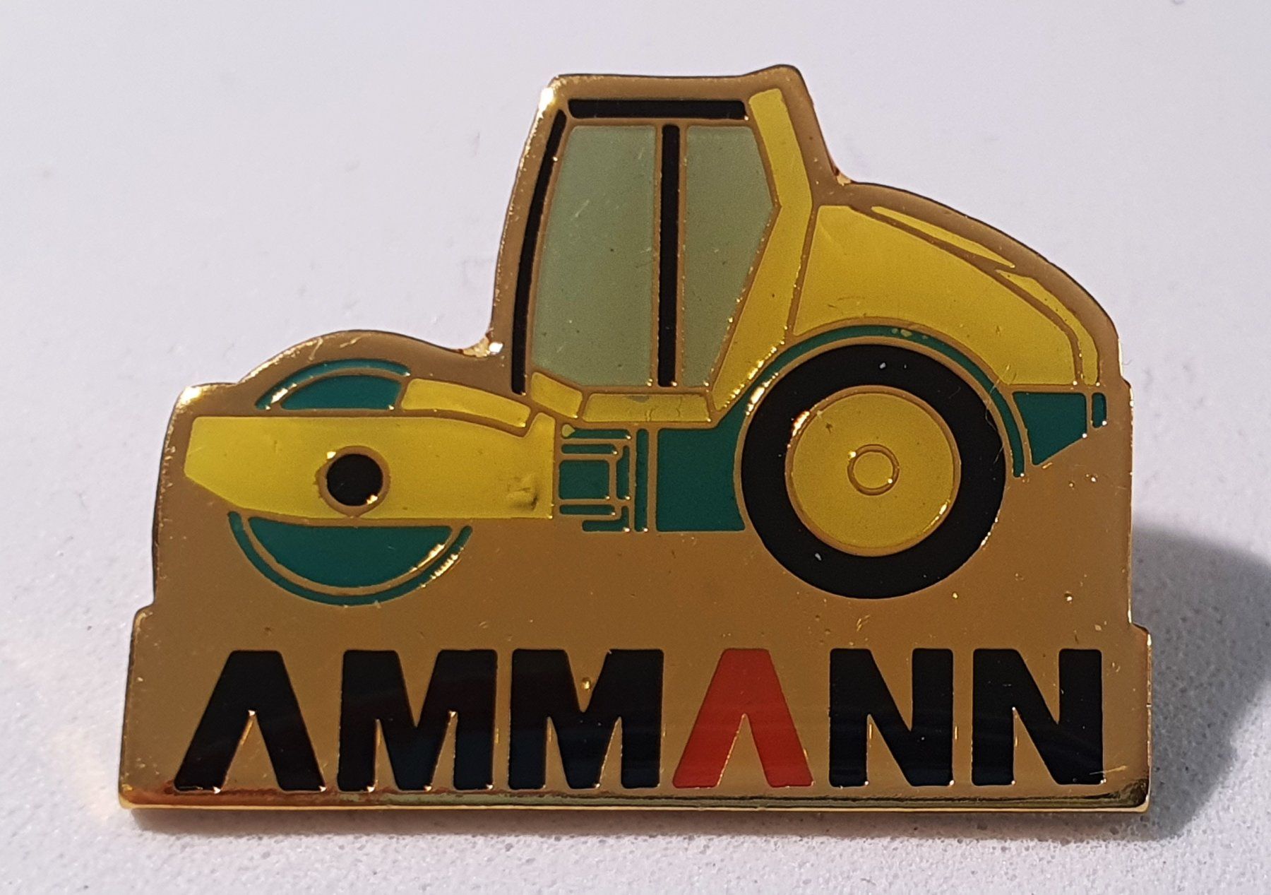 Placchette & Badge: AA917 - Pin Walze Firma AMMANN – Usato da Reinach BL venduto da Boston-Verkauf