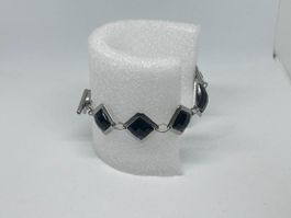 Bracciale di bigiotteria argentato con pietre nere romboidal