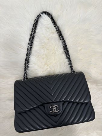 Jumbo Chanel double flap bag in chevron matte black