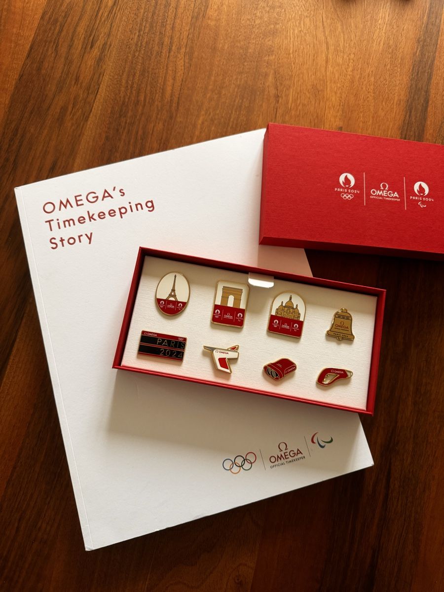 Omega Orologi: Omega Paris - PIN Set und Buch – Nuovo (secondo la descrizione) da Sursee venduto da Dersempacher