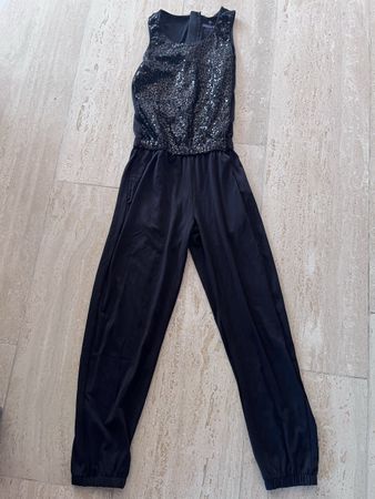 Jumpsuit 134/140 schwarz mit Pailletten