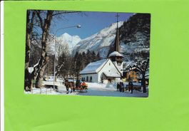 Kandersteg-Dorfstrasse-Kutsche-belebt