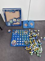Lilibiggs Murmelspiel von Migros mit Spielbrett und Murmeln