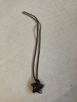Collana con ciondolo stella nero e oro vetro di Murano