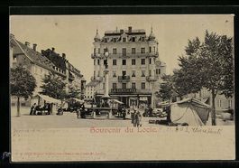 Locle, Marktplatz mit Geschäft und Brun