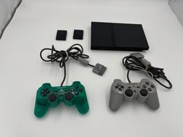 Console PlayStation 2 avec 2 manettes et 2 cartes mémoire