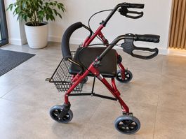 Rollator mit Sitz und Korb rot gebrauchter Zustand