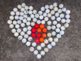 100 Golfbälle weiss/orange-rot gebraucht