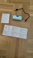Power Bank mintgrün mit USB Kabel und Anleitung