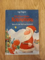Der kleine Drache Kokosnuss besucht den Weihnachtsmann.