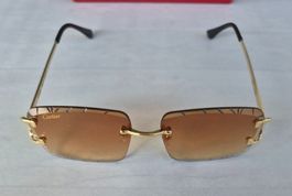 Cartier braun Sonnenbrille mit goldfarbenem Rahmen