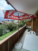 Sonnenschirm Rivella