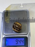 Tigerauge-Edelstein, poliert, warmer Herbstton, 9.44 Gramm.