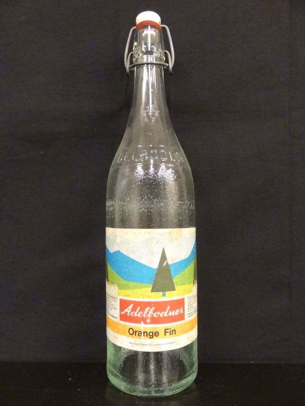 Bicchieri, Caraffe & Bottiglie: alte Flasche ADELBODNER ORANGE FIN 1962 – Usato da Kerzers venduto da Flaschenposten