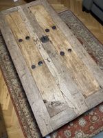 Solid wood coffee table made from reclaimed door, rustic loo