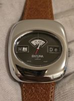 Montre Sicura mecanic.. a guichet.  Swiss made 
