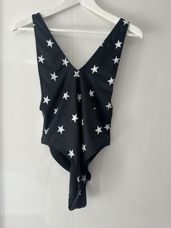 Black one piece swimming suit with stars