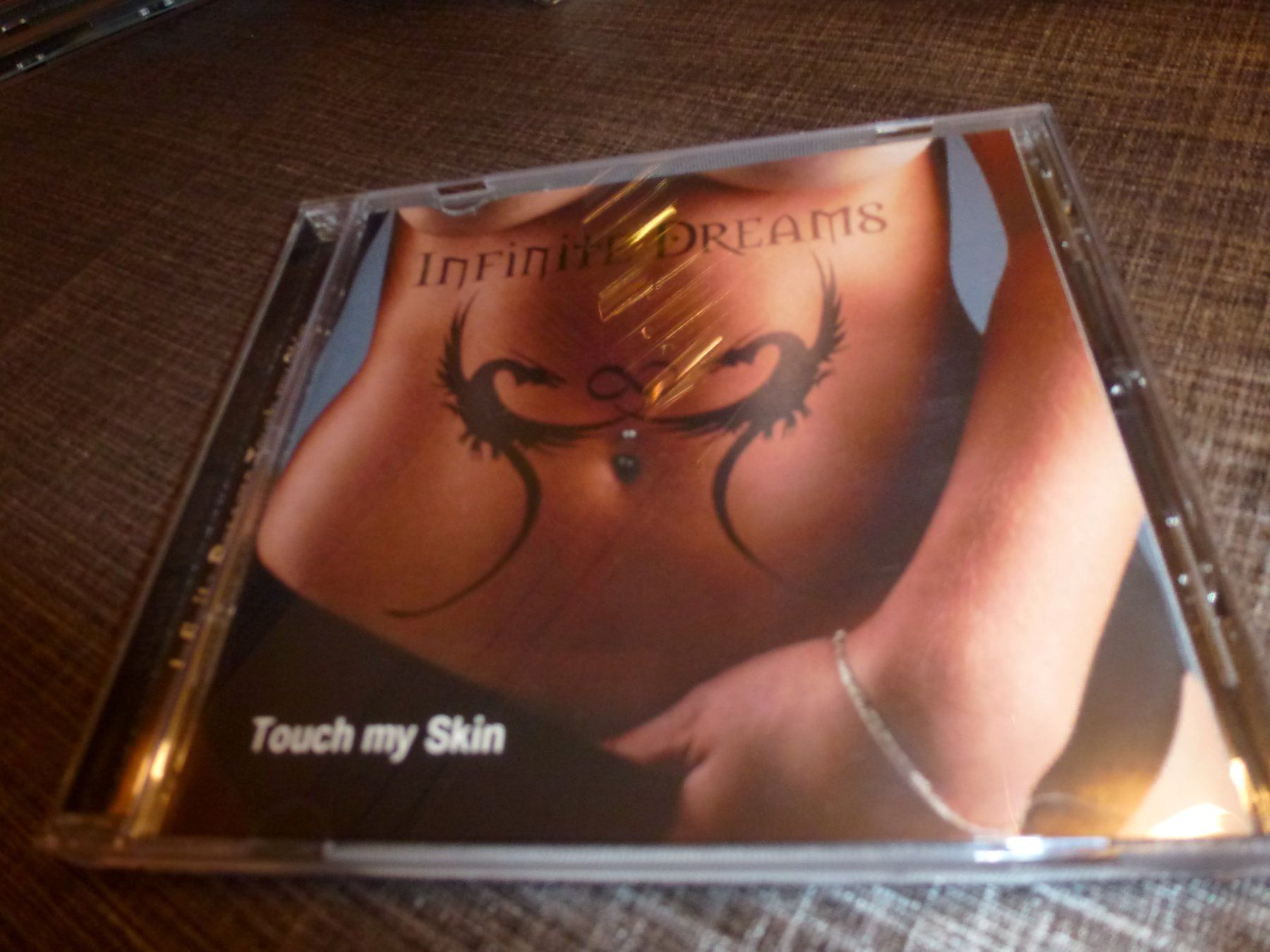 CDs: Infinite Dreams – Touch My Skin CD – Gebraucht aus Olten von Disc-Ausverkauf