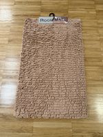 Beige floor mat