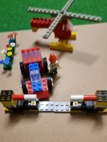 Lego Auto, Helikopter, Barriere und Blumen