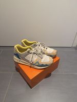 Baskets Le Coq Sportif beige bleu jaune état moyen