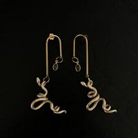 Boucles d'oreilles serpent dorées style vintage