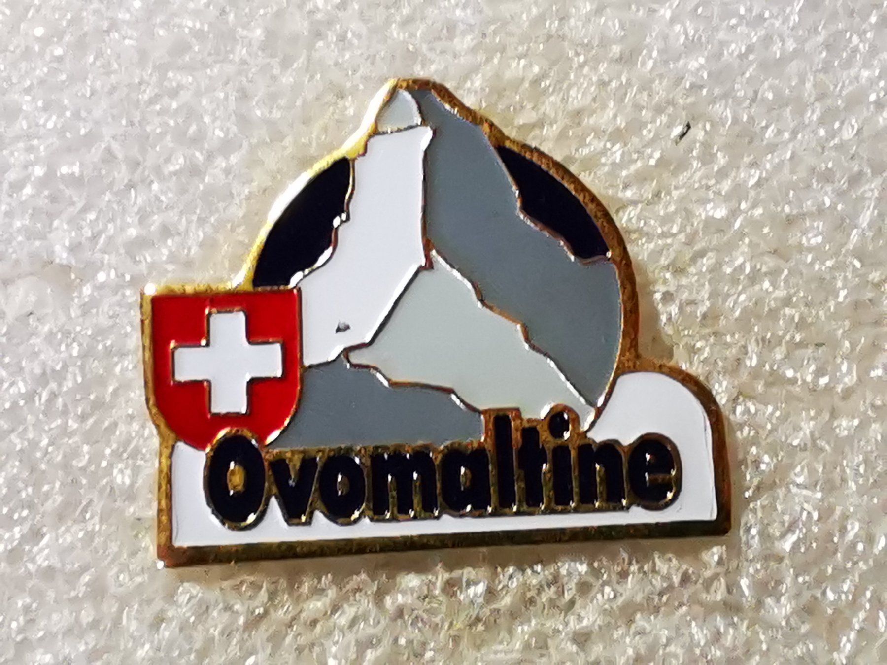 Placchette & Badge: Ansteckpin 57: Ovomaltine – Usato da Oppligen venduto da Pin-Fall-Shop