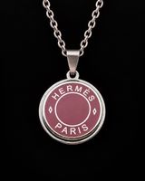 Pendentif / collier Clou de Selle Hermes en émail rose
