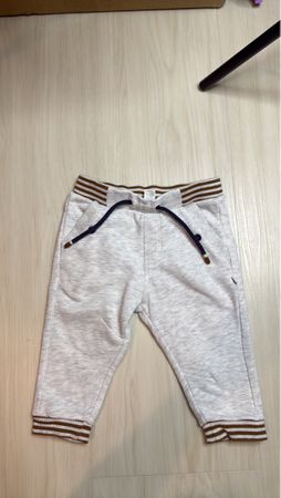 Grey jogging bottoms with striped cuffs, size 12 months