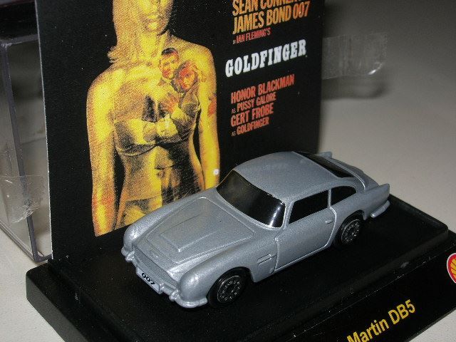 Aston Martin Modellini d'auto: Aston Martin DB5 Bond  * TIC TOC ca. 1:64, – Nuovo e nell'imballaggio originale da Hornussen venduto da Amw
