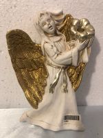 Figurine ange avec bougeoir en céramique
