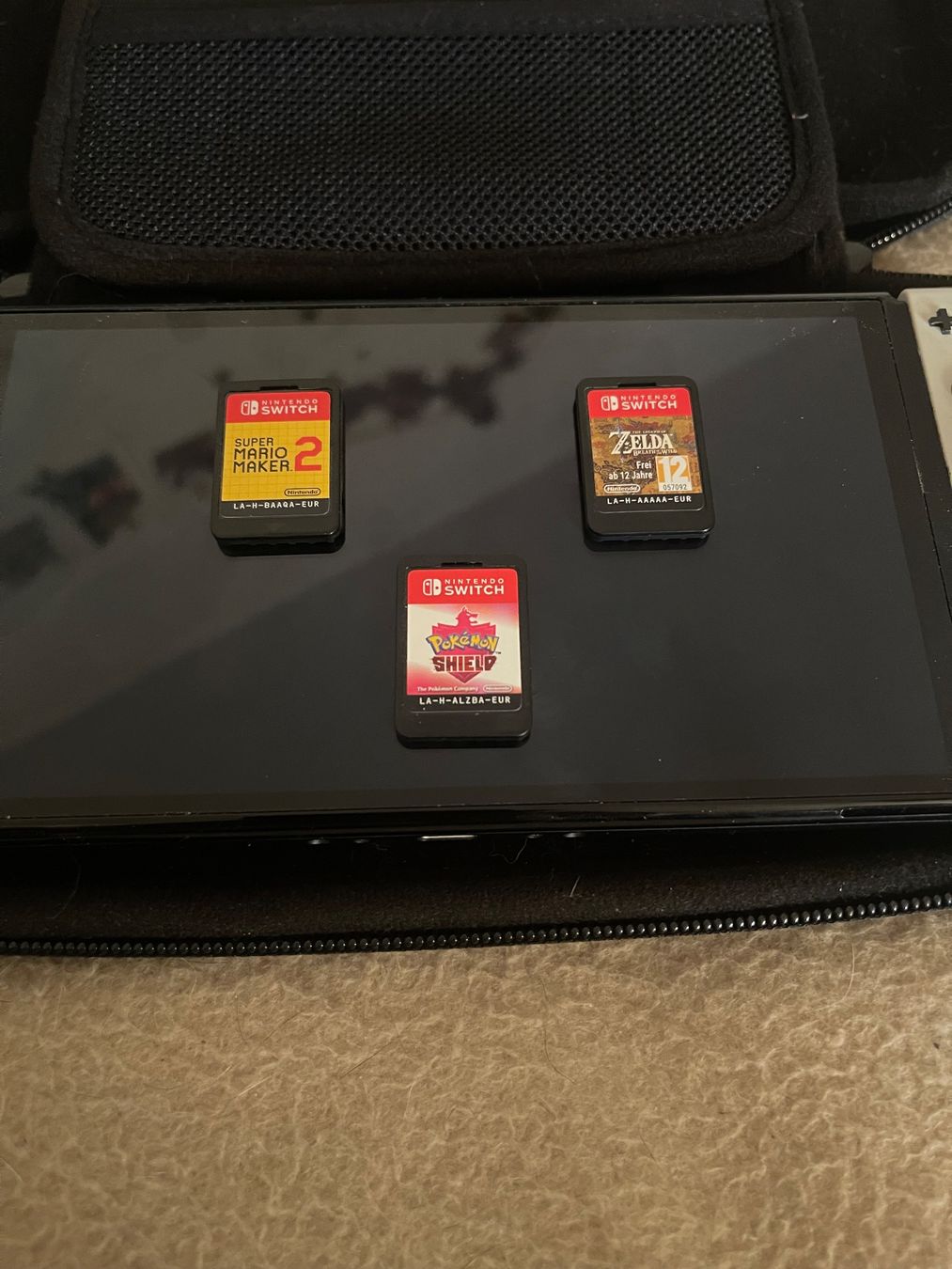 Nintendo Konsolen: Nintendo Switch OLED + Zelda + Mario Maker 2 + Pokémon – Gebraucht aus Meinisberg von 639_PokeStore 1
