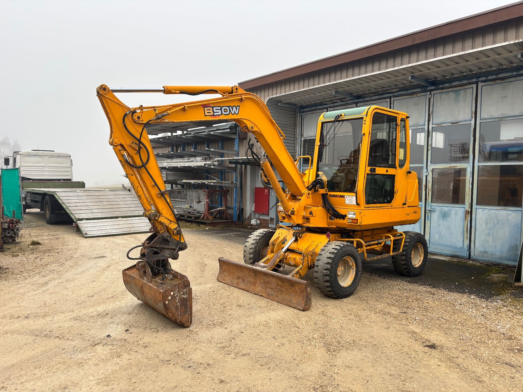Yanmar Escavatori: Bagger Yanmar 5,5t / Radbagger / Pneubagger / Mobilbagger – Usato da Courgevaux venduto da Querly 1