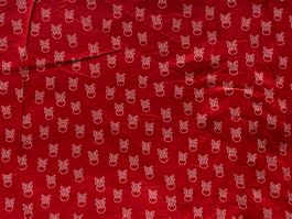 Tissu coton rouge imprimé têtes de mort