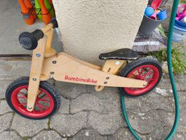 Laufrad BambinoBike aus Holz mit roten Felgen gebraucht