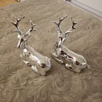 Zwei Dekofiguren weihnachts  hirsche  silberl