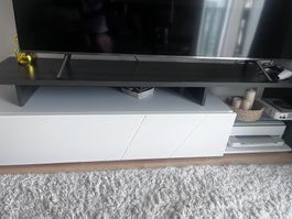 Modern TV stand with storage, white front, grey top