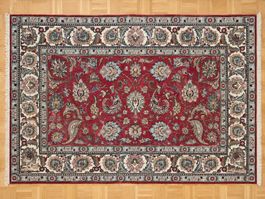 Grand tapis de style oriental rouge à motifs floraux