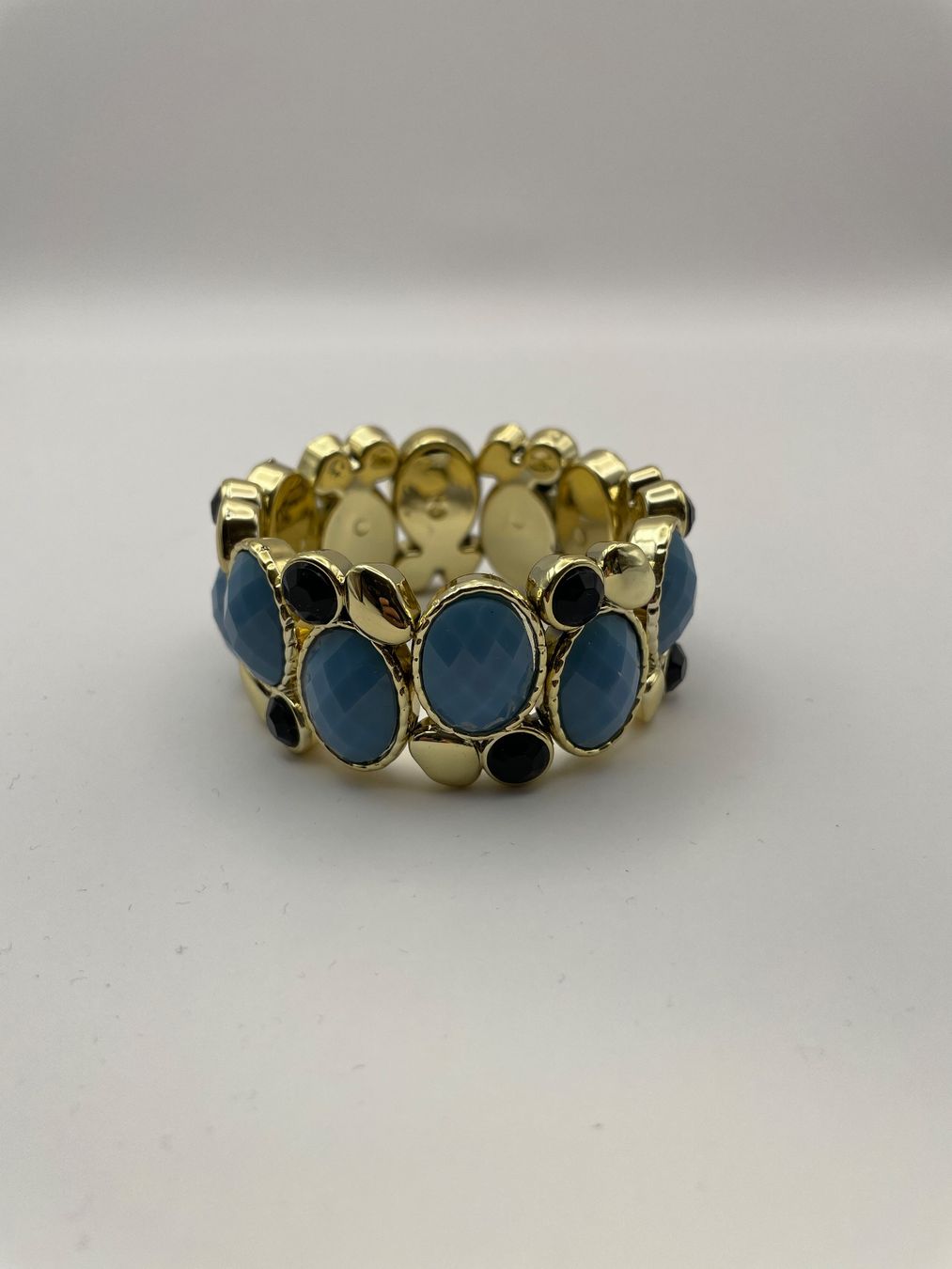 Armbänder & -reifen: Armband mit blauen Steinen, goldfarben – Gebraucht aus Auenstein von moin.